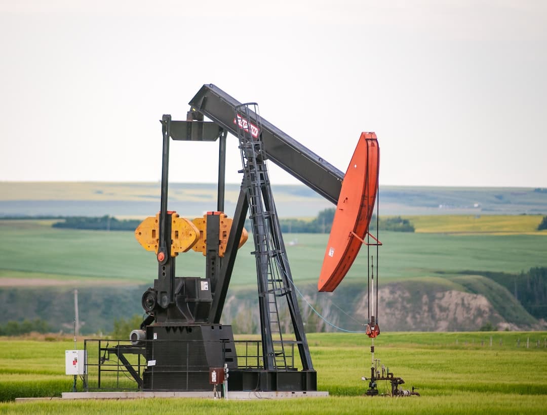 Oil field pumpjack equipment in an open field